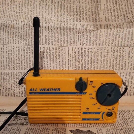 Image of All weather yellow retro old radio