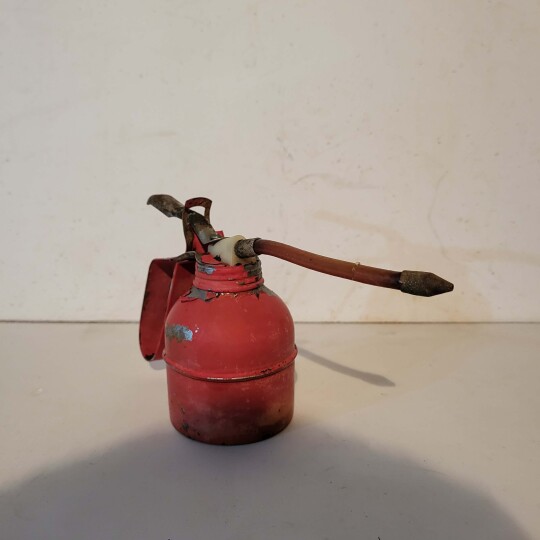 Image of Old Oil squirt can in red color
