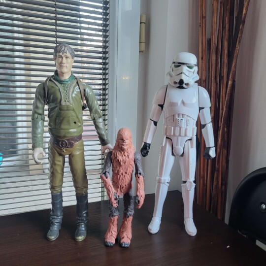 Image of Three vintage old toys - Star Wars Stormtrooper, Chewbacca and Robin Hood