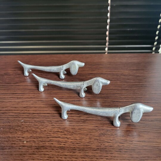 Image of Vintage French sausage dog shaped silver plate cutlery rests,